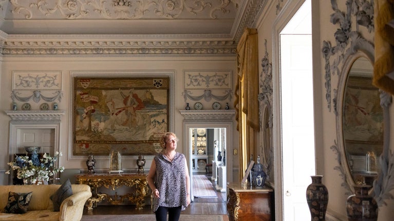 Room view of the Drawing Room at Wallington with a visitor walking through, Northumberland